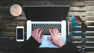 Man working at computer. Image credit: Stanley Dai on Unsplash